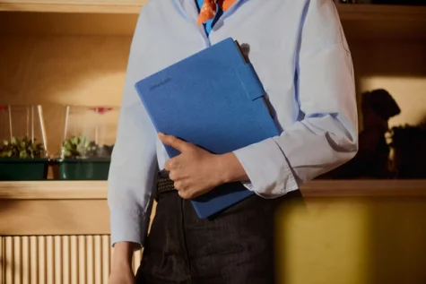 A person holding their reMarkable Paper Pro with a Book Folio