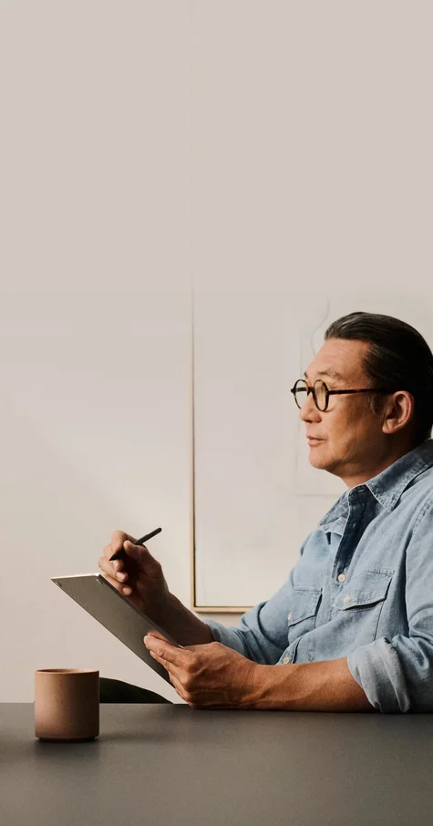 A man using a reMarkable Paper Pro and Marker Plus in a calm office environment