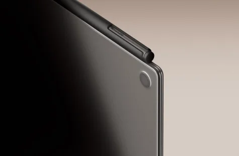Close-up of the top left corner of a reMarkable Paper Pro with the Marker Plus attached, captured from behind.