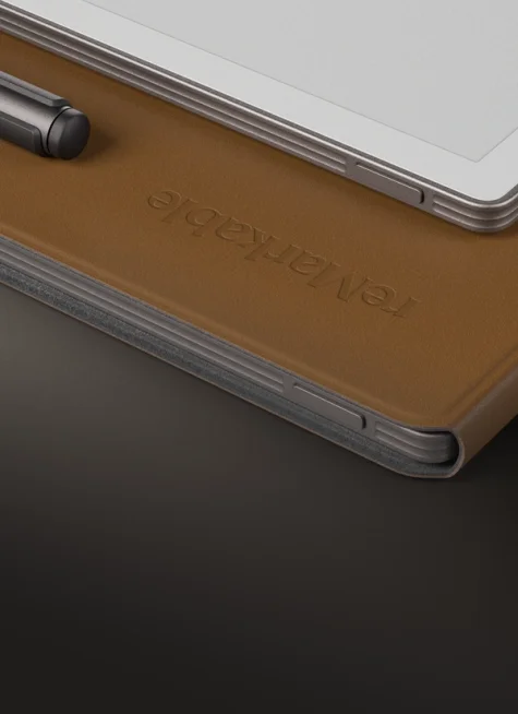 Two reMarkable Paper Pro devices, one with Book Folio leather brown